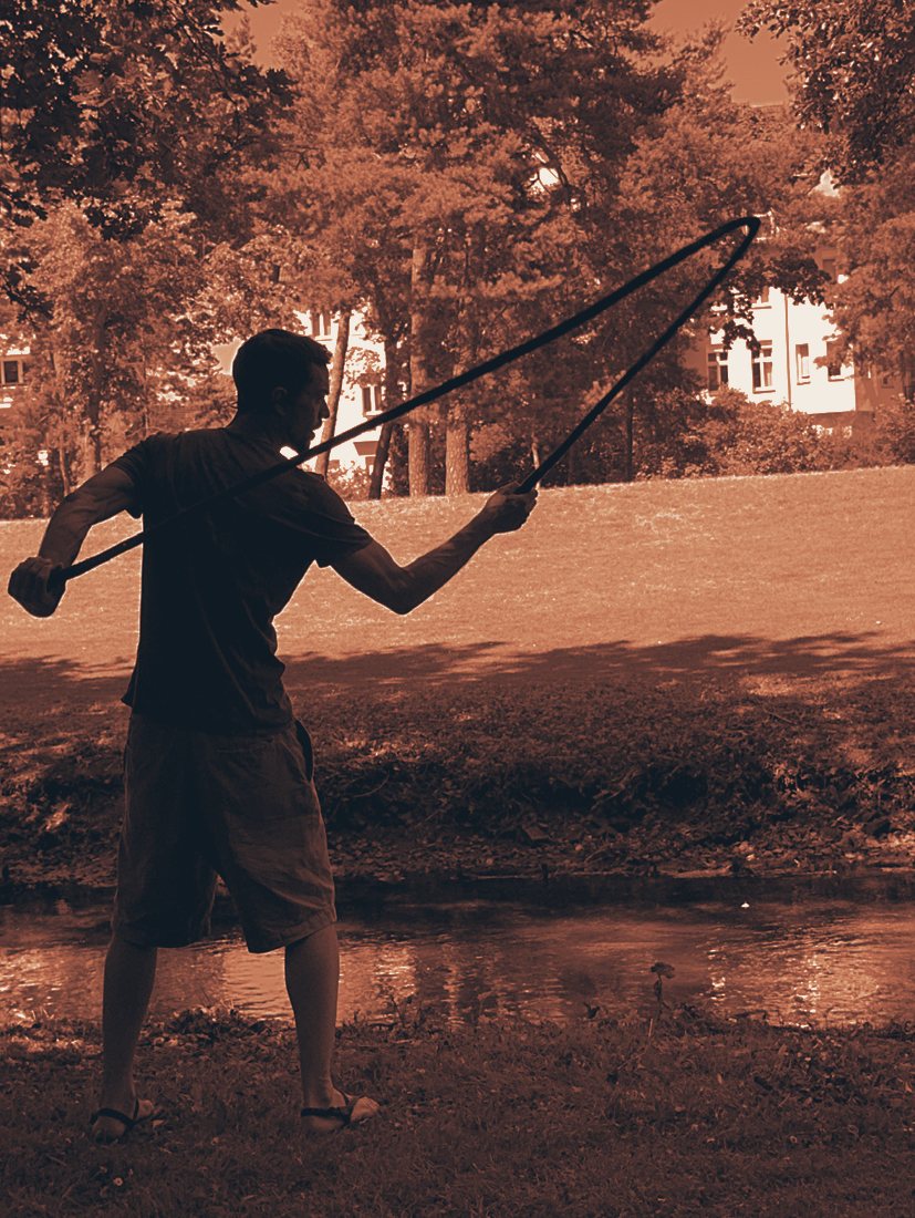 Rope Flow in motion — rope mid-arc, by the water (Berlin)